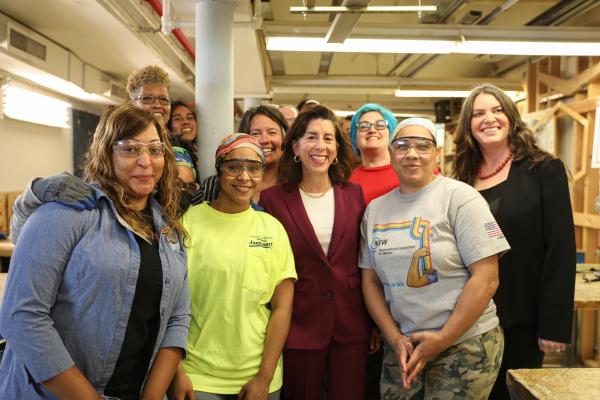 Commerce Secretary Gina Raimondo with employees at the Nontraditional Employment for Women (NEW) in New York City.