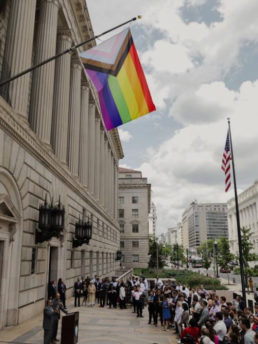 The Progress Pride Flag outside the Commerce Department building.